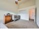 Bedroom featuring neutral colors, carpeted floors, a crib, dresser, closet and an interior door at 12282 Bannock Cir # A, Denver, CO 80234
