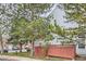 Charming home exterior with a backyard patio, mature trees, and manicured landscaping at 12282 Bannock Cir # A, Denver, CO 80234