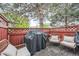 Outdoor patio area with deck, grill and wicker furniture for outdoor entertainment at 12282 Bannock Cir # A, Denver, CO 80234