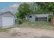 A home's backyard with a detached garage at 3256 S Ogden St, Englewood, CO 80113
