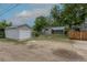 A home's backyard with a detached garage at 3256 S Ogden St, Englewood, CO 80113