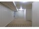 Spacious finished basement featuring neutral carpet, storage closets, and access to additional areas at 3256 S Ogden St, Englewood, CO 80113