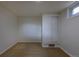 Finished basement bedroom features neutral carpet, a storage closet, and a window at 3256 S Ogden St, Englewood, CO 80113