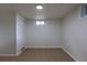 Finished basement bedroom features neutral carpet, a storage closet, and a window at 3256 S Ogden St, Englewood, CO 80113