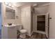 This bathroom has a modern vanity, toilet and a shower with a glass door at 3256 S Ogden St, Englewood, CO 80113