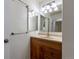 This bathroom features a modern vanity with ample lighting and mirror at 3256 S Ogden St, Englewood, CO 80113