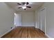 Bedroom boasting hardwood floors, a ceiling fan, and closet storage at 3256 S Ogden St, Englewood, CO 80113