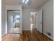 Bedroom offering hardwood floors, mirrored closet, and view of the archway at 3256 S Ogden St, Englewood, CO 80113