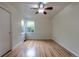 Comfortable bedroom featuring hardwood floors, a ceiling fan, and natural light at 3256 S Ogden St, Englewood, CO 80113
