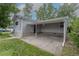 The side of a home with a covered carport and access to the home at 3256 S Ogden St, Englewood, CO 80113