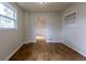 Bright dining room with hardwood floors, a window, and built-in shelving at 3256 S Ogden St, Englewood, CO 80113