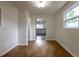 Dining room with wood floors and a view into the kitchen area at 3256 S Ogden St, Englewood, CO 80113