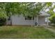 Quaint single-story home featuring a well-manicured lawn and mature trees at 3256 S Ogden St, Englewood, CO 80113