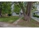 Single-story home with lawn and mature trees at 3256 S Ogden St, Englewood, CO 80113