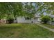Charming single-story home featuring a well-manicured lawn and beautiful trees in a cozy neighborhood at 3256 S Ogden St, Englewood, CO 80113