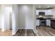 The kitchen features modern stainless steel appliances and granite countertops at 3256 S Ogden St, Englewood, CO 80113