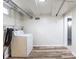 This Laundry room has a washer and drier with vinyl floors and white walls at 3256 S Ogden St, Englewood, CO 80113
