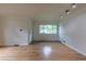 Cozy living room featuring hardwood floors and a large window at 3256 S Ogden St, Englewood, CO 80113
