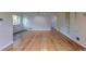 Spacious living room with hardwood floors and seamless transition to other rooms at 3256 S Ogden St, Englewood, CO 80113