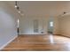 Open living room featuring hardwood floors, recessed lighting, and arched doorways at 3256 S Ogden St, Englewood, CO 80113
