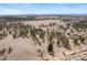 Expansive aerial view of property and surrounding landscape featuring mountains in the distance at 121 County Road 146, Elizabeth, CO 80107