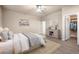 Bedroom featuring neutral walls, a ceiling fan, and a comfortable bed with a plaid throw at 121 County Road 146, Elizabeth, CO 80107