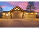 Beautiful home with a three car garage and stunning stone and wood accents at 121 County Road 146, Elizabeth, CO 80107