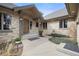 Inviting front entrance with stone facade, a covered porch, and a landscaped garden with a decorative fountain at 121 County Road 146, Elizabeth, CO 80107