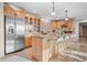 Kitchen with island, stainless steel appliances, and natural cabinets at 121 County Road 146, Elizabeth, CO 80107