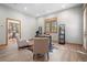 Office with neutral walls and wood-look flooring, furnished with a desk, chairs, and shelving at 121 County Road 146, Elizabeth, CO 80107