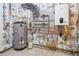 Utility room with modern water heater, pipes, and a manifold system at 121 County Road 146, Elizabeth, CO 80107