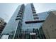 Stunning high-rise building with sleek glass facade and multiple balconies offering city views at 4200 W 17Th Ave # 411, Denver, CO 80204
