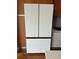 Close-up of the kitchen refrigerator showcasing modern design and sleek white finish at 4200 W 17Th Ave # 411, Denver, CO 80204