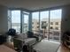 Inviting living room featuring large windows, plush sofa, and stylish decor providing a comfortable living space at 4200 W 17Th Ave # 411, Denver, CO 80204