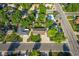 An aerial view of the property showcases its location, landscaping, and proximity to nearby streets at 6114 Miller St, Arvada, CO 80004