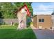 Whimsical backyard with treehouse feature, outbuilding, and landscaping at 6114 Miller St, Arvada, CO 80004