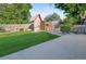 Beautiful backyard with a functional playhouse and a manicured lawn behind the house at 6114 Miller St, Arvada, CO 80004