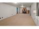 Basement with neutral walls and light carpeting, and a wood-burning fireplace adding charm at 6114 Miller St, Arvada, CO 80004