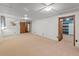 Large basement with neutral walls, carpeting, drop ceiling, and many potential layouts at 6114 Miller St, Arvada, CO 80004