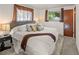 Cozy bedroom with a plush bed, soft carpeting, and natural light at 6114 Miller St, Arvada, CO 80004