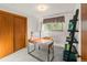 Bedroom/Office features a closet, a work desk and a comfortable chair near the window at 6114 Miller St, Arvada, CO 80004