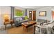 Sunlit living room with stylish furnishings and a warm, inviting ambiance at 6114 Miller St, Arvada, CO 80004