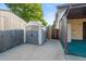 Backyard featuring a shed for extra storage and a side gate for maintenance in fenced in yard at 6114 Miller St, Arvada, CO 80004