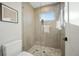 Modern bathroom with a glass-enclosed shower, tiled floors, and contemporary fixtures at 2330 Eliot St # 2, Denver, CO 80211