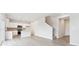 Open-concept area featuring a modern kitchen with white cabinets, an island, and seamless access to the living space at 19089 E 94Th Pl, Commerce City, CO 80022