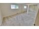 Bright bedroom featuring neutral carpet, natural light and a large mirrored closet at 315 E 112Th Dr, Northglenn, CO 80233