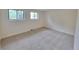 Inviting bedroom featuring soft carpet and ample natural light from the large window at 315 E 112Th Dr, Northglenn, CO 80233