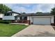 Charming two-story home with a well-manicured lawn, front porch, and a two car garage at 315 E 112Th Dr, Northglenn, CO 80233