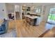 Bright open-concept kitchen featuring a large island, stainless appliances, and hardwood floors at 315 E 112Th Dr, Northglenn, CO 80233