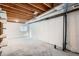 Unfinished basement with concrete floor, exposed wood ceiling and ductwork, ready for customization at 8197 S Fillmore Way, Centennial, CO 80122